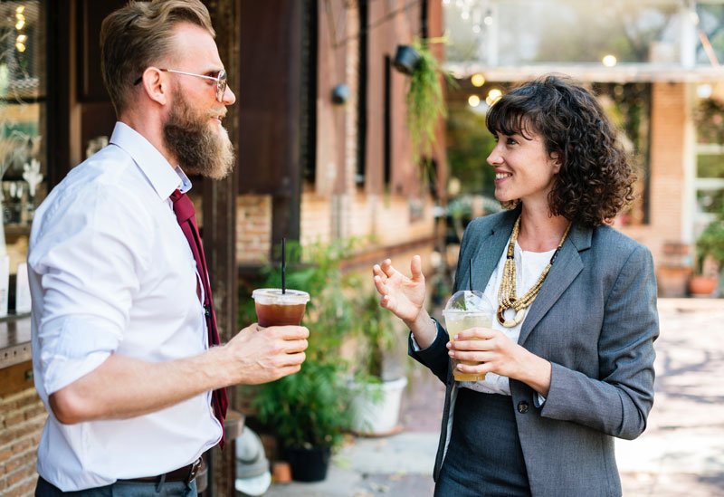 business owner having a beverage and getting to know her customer.